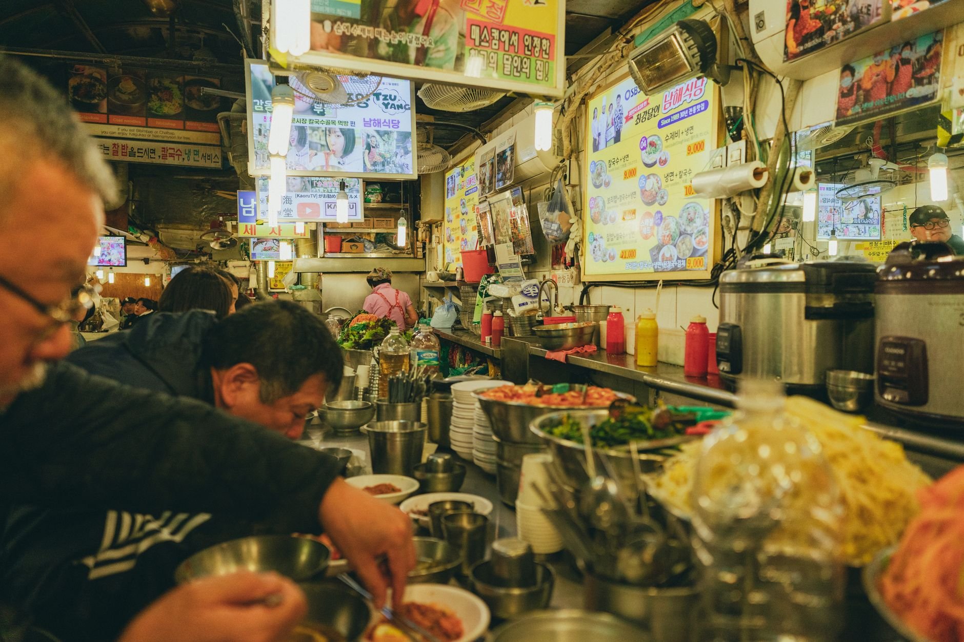 Vibrant street food market scene — bustling energy of a local food stall